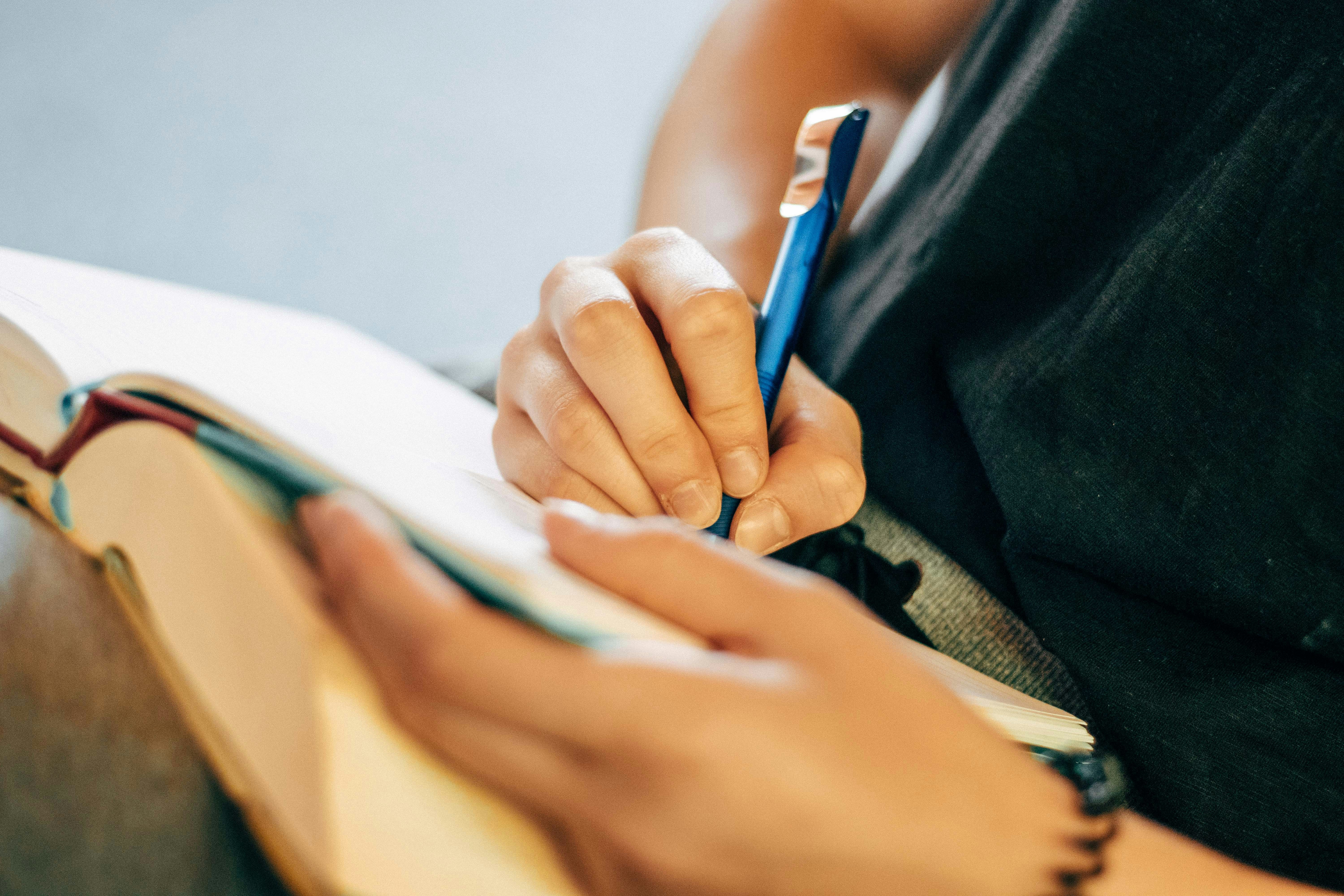 Person Writing Notes in notebook for The Good Shepherd Part 1